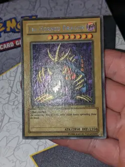 Yu-Gi-Oh! TCG Tri-Horned Dragon LOB-000 1st Edition Near Mint Secret Rare card - Image 1