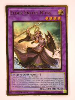 YuGiOh - Elder Entity N’Tss MAGO-EN026 - Gold Rare - 1st Edition - LP/NM - Image 1