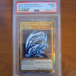 2024 YU-GI-OH! MP24-25TH ANV TIN: DUELING MIRRORS BLUE-EYES WHITE DRAGON PSA 9 - Image 1