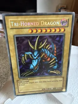 Yu-Gi-Oh! Tri-Horned Dragon LOB-000 1st Edition Secret Rare Wavy Faded - Image 1