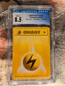 CGC 8.5 NM/MINT Lightning Energy 100/102 1st Edition Base set 1999 Pokemon Card - Image 1