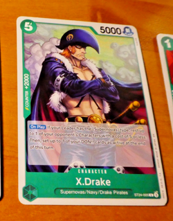 ONE PIECE ENGLISH CARD GAME CARTE X.DRAKE ST24-005 ST EN MINT - Image 1