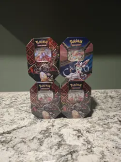 Pokemon TCG: Paldean Fates Charizard EX Tin x3 + Heros V Tin - Image 1