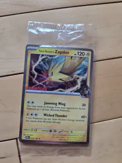 Team Rocket’s Zapdos Pokemon Promo Card - GameStop Exclusive - Holo Rare SEALED! - Image 1