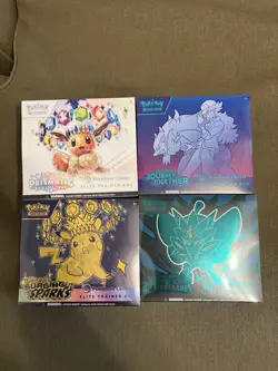 Pokemon Center ETB sealed lot (Prismatic evolutions, Surging Sparks, JT, TM) - Image 1