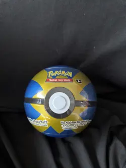 PokeMon ball tin w/ 3 Packs of cards & A Pokemon Coin New and sealed Blue & Gold - Image 1