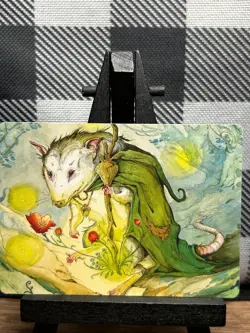 MTG TCG: Tender Wildguide 34/54, Ellie Livingston, Bloomburrow _ ART - Image 1