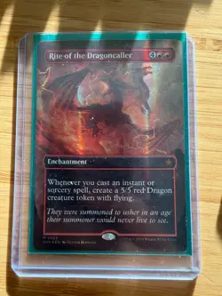 Near Mint x 1 Rite of the Dragoncaller - Mana Foil - Borderless Foundations Vari - Image 1