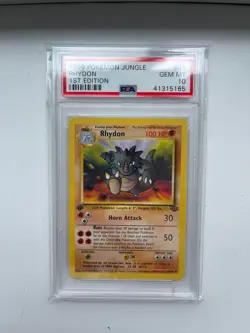 1999 Pokemon Jungle Rhydon 45/64 1st Edition Non-Holo Card PSA 10 GEM MINT - Image 1