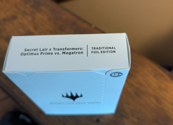 MTG Secret Lair X Transformers: Optimus Prime Vs. Megatron FOIL EDITION Sealed - Image 1