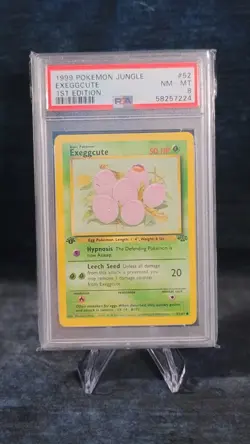 1999 POKEMON JUNGLE #52 EXEGGCUTE 1ST EDITION ENGLISH - PSA 8 - Image 1