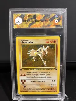 CARTA POKEMON HITMONLEE FOSSIL 1ST ED 007 GRAAD 8 NM-MT ITA HOLO - Image 1