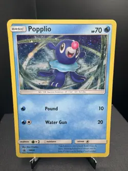 Pokemon TCG Sun & Moon Popplio SM24 Black Star Promo Cosmos Holo SWIRL MP - Image 1