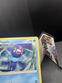 Pokemon TCG Sun & Moon Popplio SM24 Black Star Promo Cosmos Holo SWIRL MP - Image 2