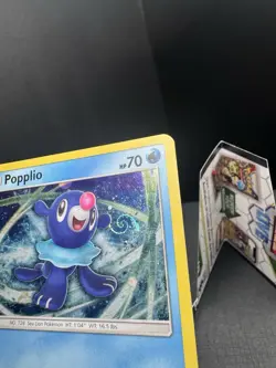 Pokemon TCG Sun & Moon Popplio SM24 Black Star Promo Cosmos Holo SWIRL MP - Image 3
