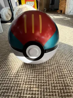Pokemon TCG - Lure Ball Tin, Pre-Owned, Comes With 25 Cards - Image 1
