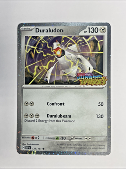 Duraludon 129/191 Surging Sparks Stamped Cosmos Holo Pokemon TCG M/NM - Image 1