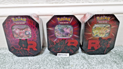 🔥POKEMON🔥SCARLET & VIOLET DESTINED RIVALS TEAM ROCKET TINS ART SET X3 SEALED - Image 1