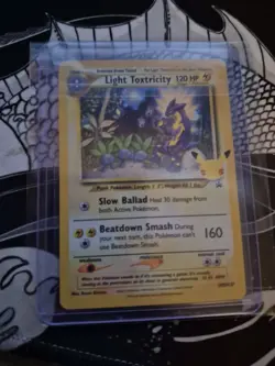 2021 Pokemon LIGHT TOXTRICITY HOLO SWSH137! Pikachu Emblem - Image 1