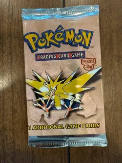 Pokemon (WOC06070) Fossil 1st Edition Booster Pack - Factory Sealed! - Image 1