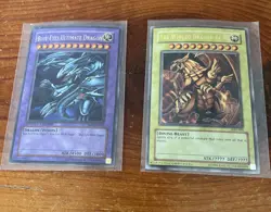 Yugioh cards The Winged Dragon of Ra and Blue Eyes Ultimate Dragon - Image 1