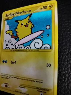 2009 Pokemon Rising Rivals Surfing Pikachu 114/111 Secret Rare Holo SWIRL NM - Image 2