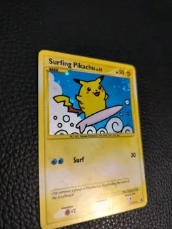 2009 Pokemon Rising Rivals Surfing Pikachu 114/111 Secret Rare Holo SWIRL NM - Image 3