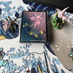 Pokemon TCG - Prismatic Evolutions Figure Collection Sleeves, Pin and Figurine - Image 1