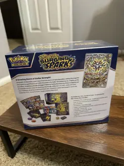 Surging Sparks ETB Factory Sealed Pokemon Cards - Image 2