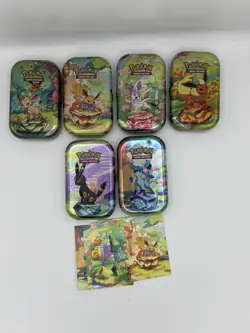 Pokemon TCG: Prismatic Evolutions - Set of 6 Mini Tins (Empty) inc Art Cards - Image 1