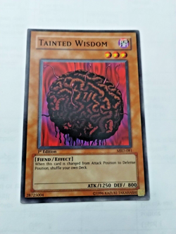 Yu-Gi-Oh! TCG Tainted Wisdom Metal Raiders MRD-081 1st Ed. Com. - Uncirculated - Image 1