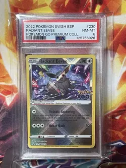2022 POKEMON SWSH #230 RADIANT EEVEE POKEMON GO PREMIUM COLLECTION PSA 8 CARD - Image 1