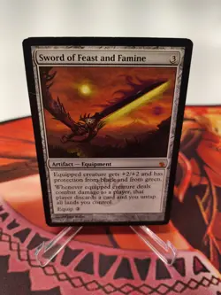 Sword of Feast and Famine Mirrodin Besieged Regular - Image 1