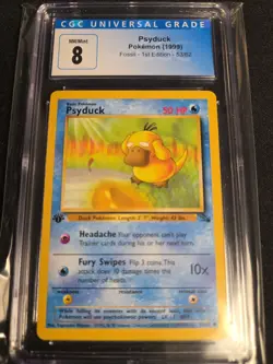 CGC NM/MINT 8 Psyduck 1st Edition Fossil Pokemon Card (1999) - Image 1