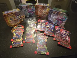Variety Lot Of 4 New Pokemon Tins & 10 Individual Packs Of Trading Cards - Image 1