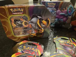 Variety Lot Of 4 New Pokemon Tins & 10 Individual Packs Of Trading Cards - Image 2