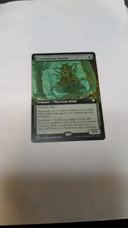 Magic the Gathering Contaminant Grafter NM Borderless Extended Art, Regular Card - Image 1