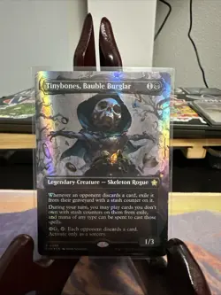 Tinybones, Bauble Burglar (Borderless) (Mana Foil) Foundations Foil - Image 1