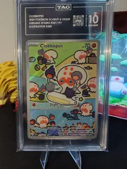 Clobbopus 207/191 IR - Pokemon TCG Surging Sparks TAG GEM MINT 10 - Image 1
