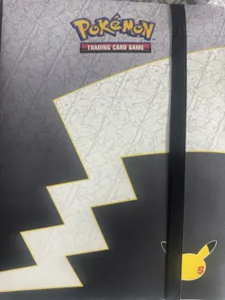 Pokemon Card Binder With 25 anniversary Cards And Other Random Stuff - Image 1
