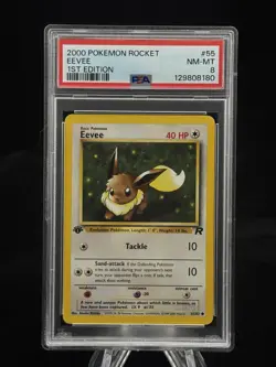 Eevee #55 1st Edition Team Rocket 2000 Pokemon PSA 8 ? - Image 1