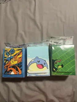 3x pokemon center deck boxes (spheal, Caterpie, And Charizard/Lucario/Pikachu) - Image 1