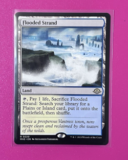 *Flooded Strand* -Modern Horizons 3 (MH3) #220- Near Mint - Regular Rare - - Image 1
