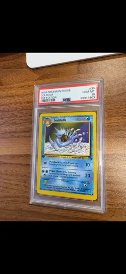1999 POKEMON FOSSIL #35 GOLDUCK 1ST EDITION PSA 10 GEM MINT - Image 1