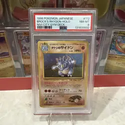 PSA 8 Brock's Rhydon 1998 Gym Heroes Japanese 112 Holo Pokemon Card With Swirl - Image 1