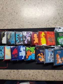 Lot of 12 Pokemon ETB Packs of Sleeves + Lot of 4 Ultra Pro Pokemon Sleeves - Image 1
