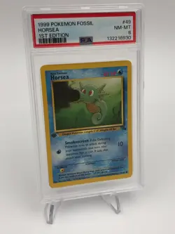 1999 POKEMON FOSSIL Trading Card HORSEA #49/62 1ST EDITION graded slab PSA 8 - Image 1