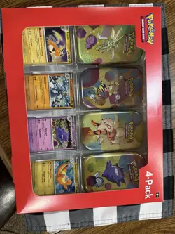 Pokemon Scarlet And Violet 151 4 Pack Mini Tins Factory Sealed box has a bend - Image 1