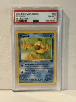 1999 POKEMON FOSSIL 1ST EDITION #53 PSYDUCK PSA 8 - Image 1