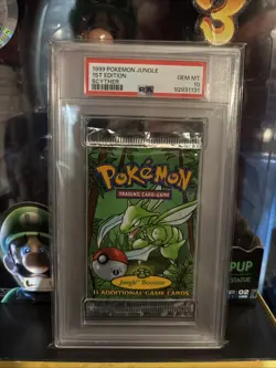 1999 Pokemon PSA 10 GEM MINT 1st Edition Jungle Booster Pack Scyther - Image 1